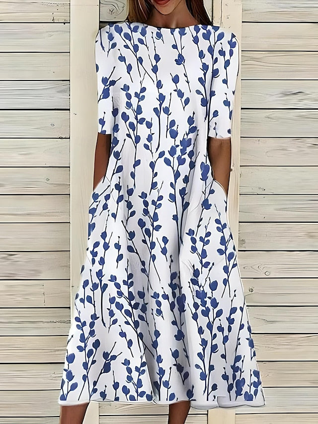 Sommerliches mittellanges Kleid mit ansprechendem Blumenmuster